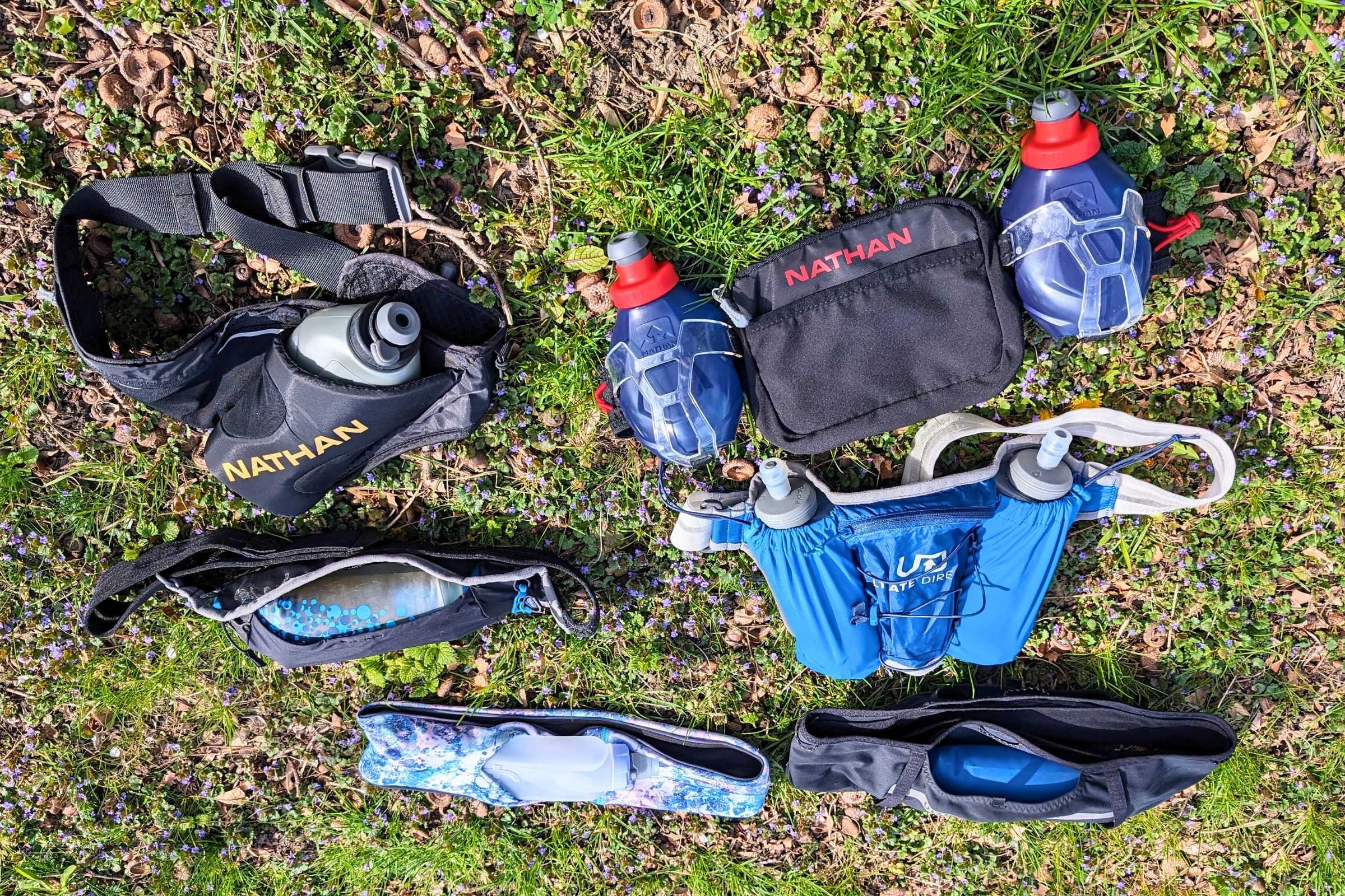 Side-by-side comparison of different running belts with soft flask and hydration bottle features.