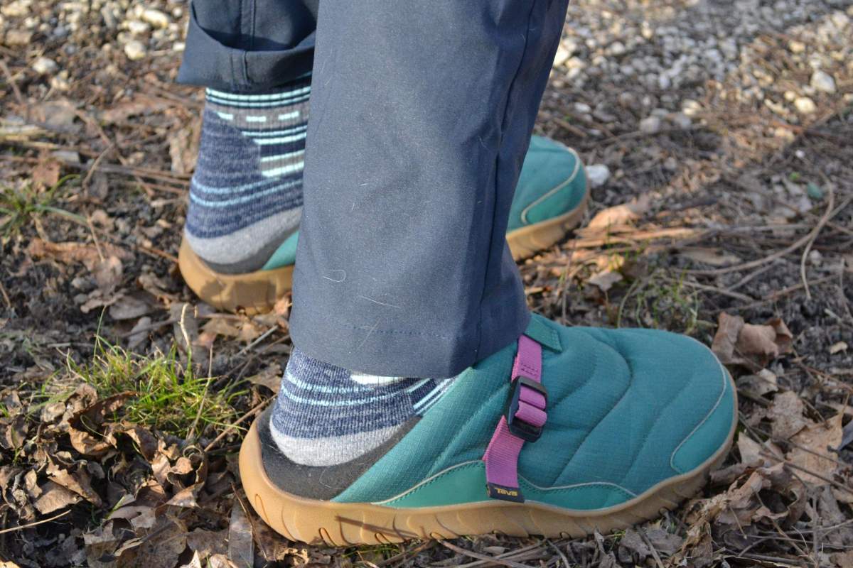 Close-up of a person's foot wearing the Teva shoe as a slide/slipper.