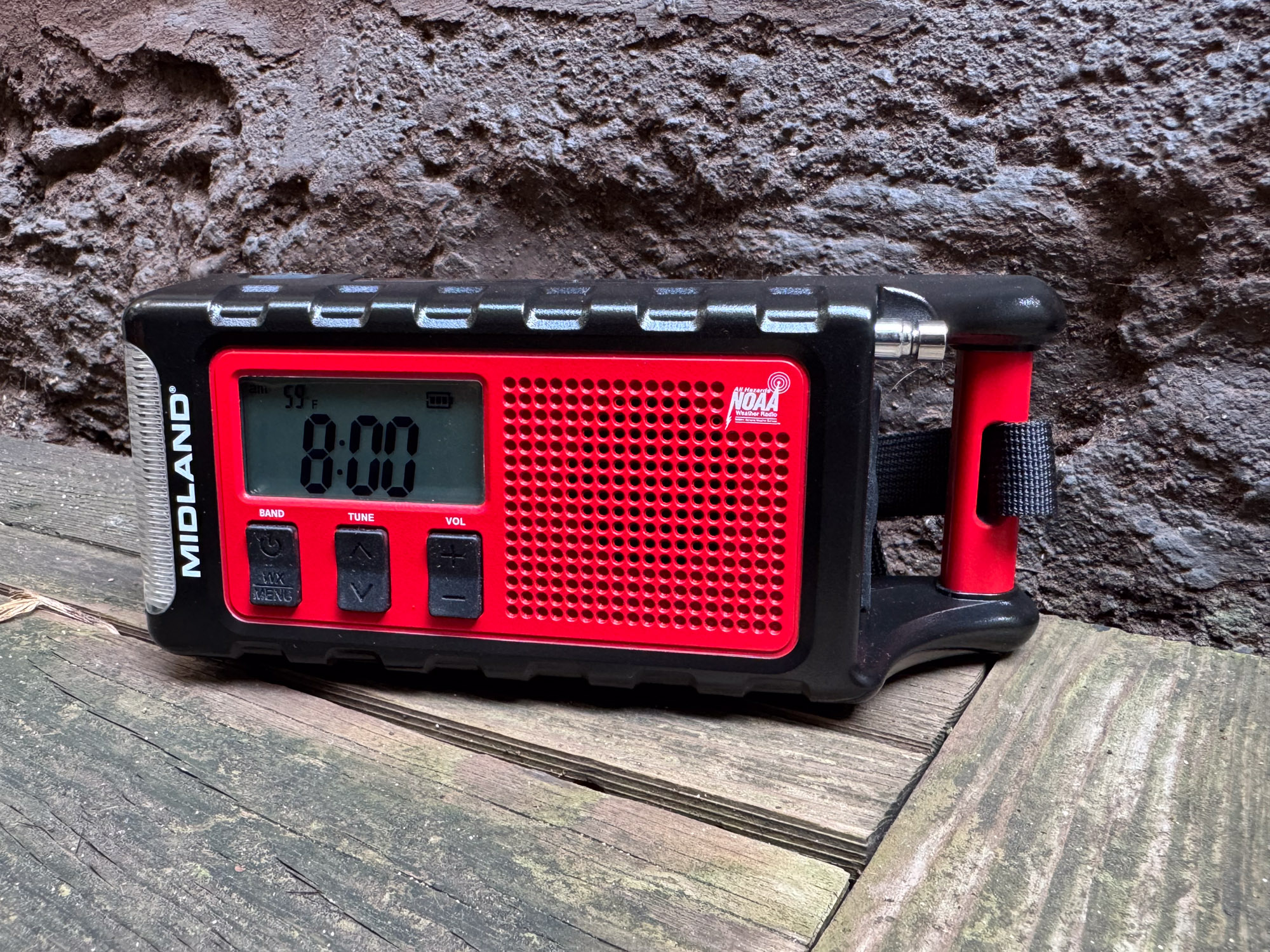 Full view of the Midland ER310PRO radio on a wooden background.