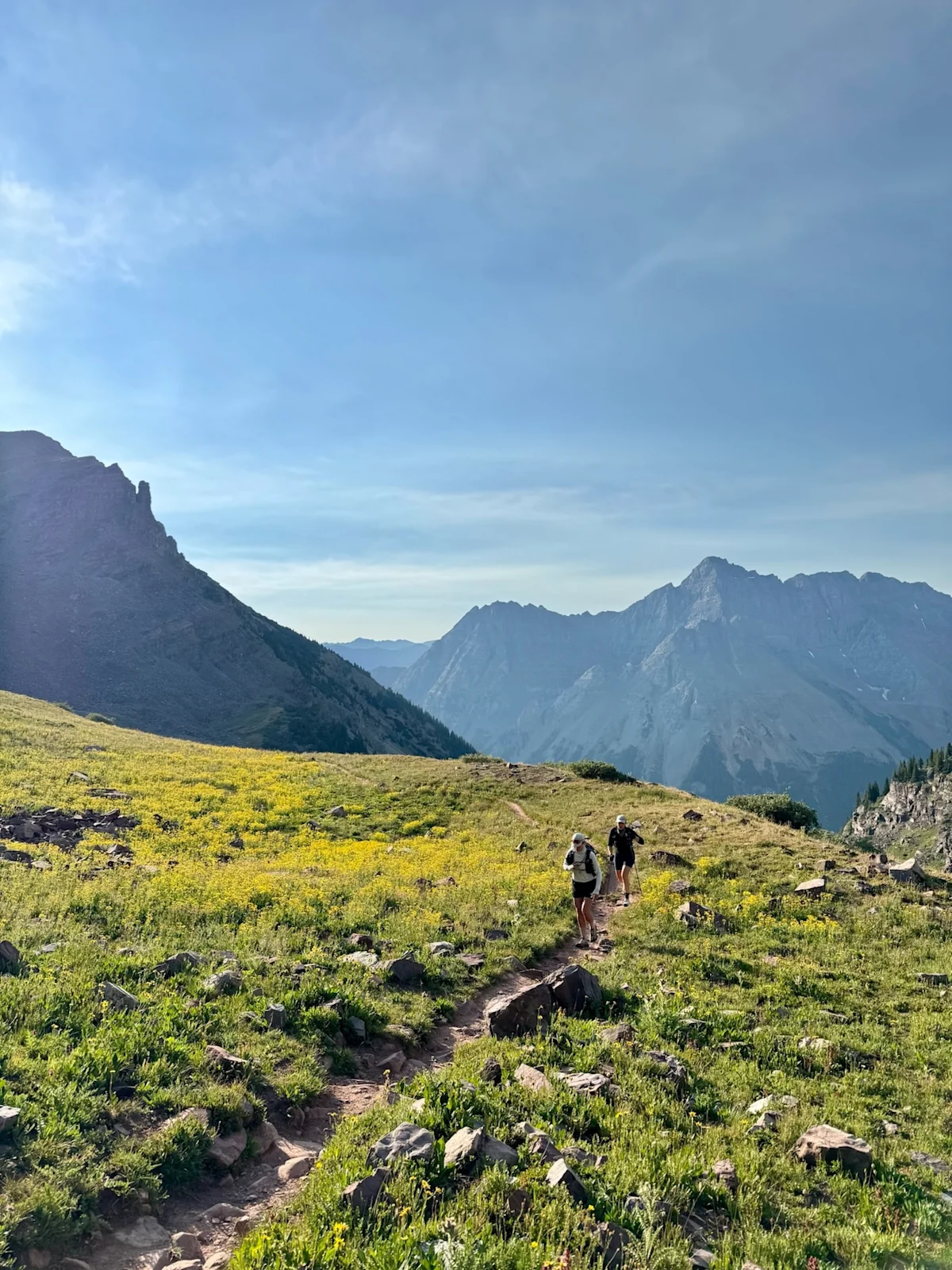 Vertical shot of the first morning light hitting the peaks near Buckskin Pass.