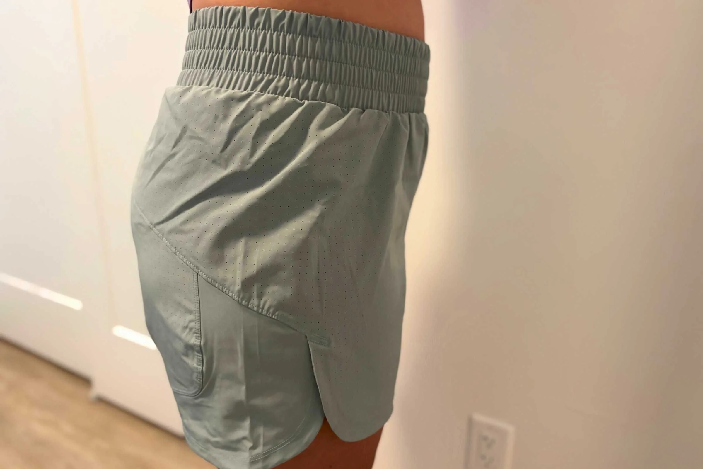 A pair of Adidas Racer Pacer shorts, featuring a lightweight and breathable design.