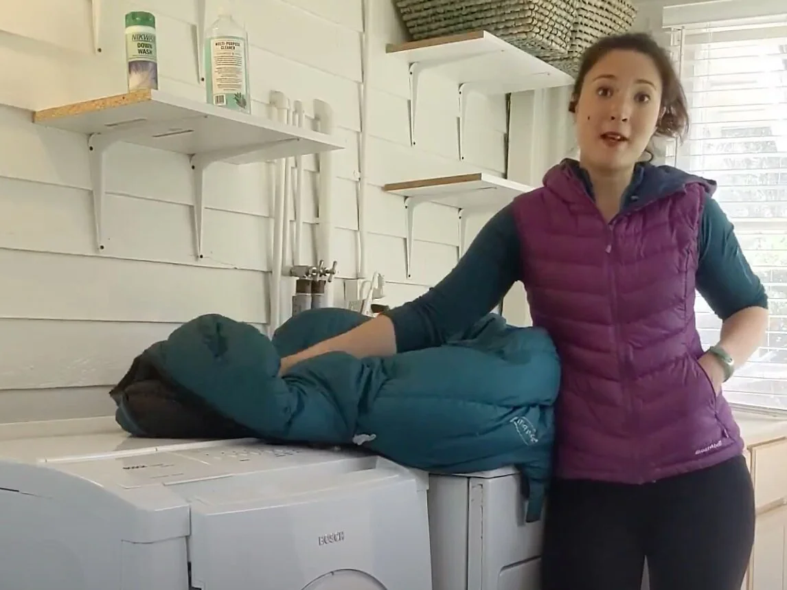 A down jacket inside the drum of a front-loading washing machine.