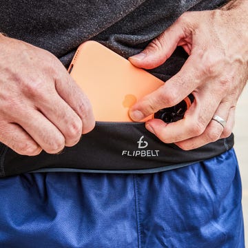 A Pink FlipBelt Classic running belt showing its seamless, pocketless-entry design.