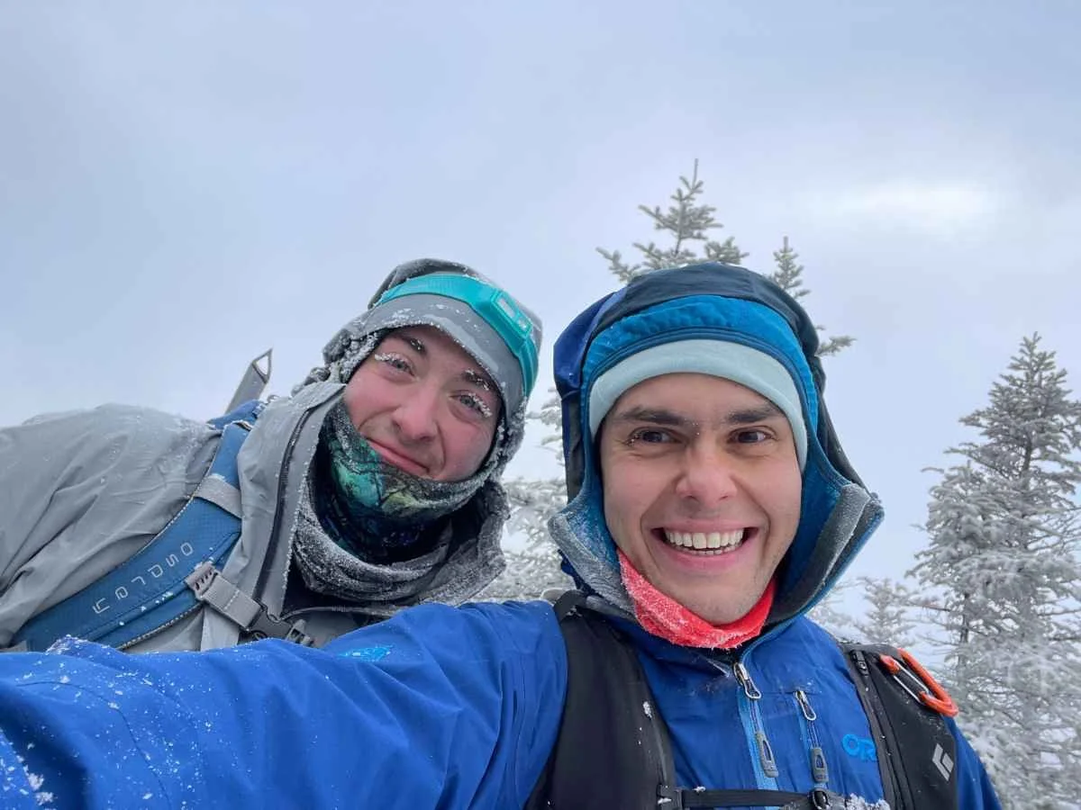 An outdoor gear tester hiking through the Adirondack Mountains in -20 degree windchill.