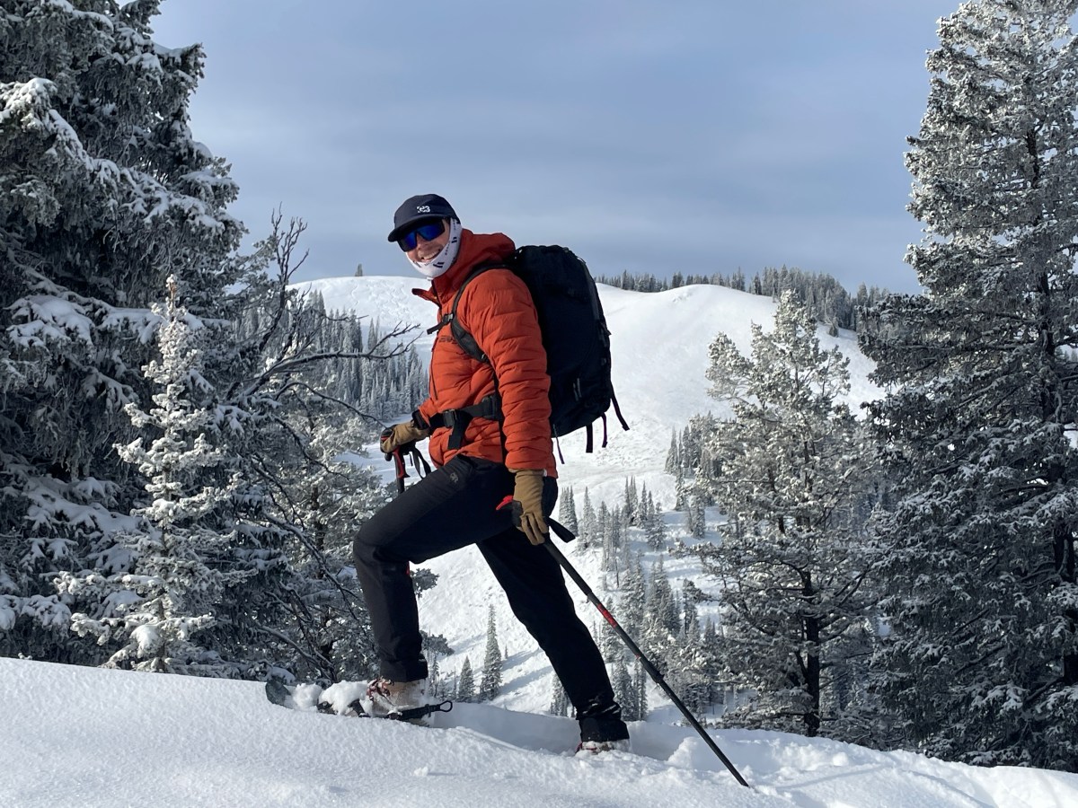 Expert testers evaluating various snowshoes in deep winter powder.