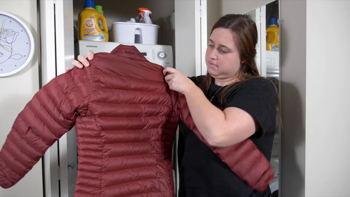 A down jacket showing signs of loss of volume and clumping.