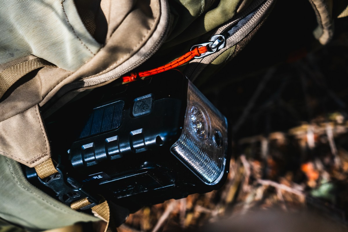 The Midland ER310PRO showing icons for its various charging and power capabilities.
