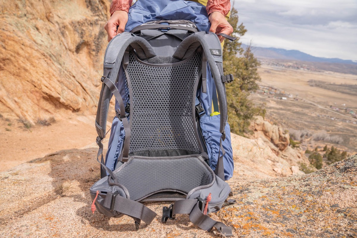 Detailed view of a trampoline-style mesh back panel showing the air gap between the frame and the fabric.