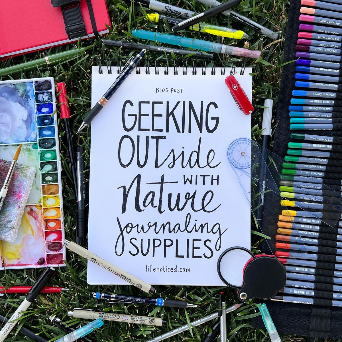 A collection of portable watercolor pans, brushes, and fine-liner pens for field use.