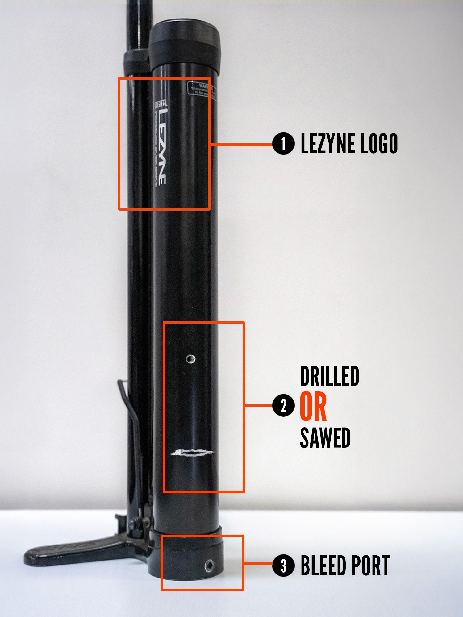 An aluminum pump canister with a large hole drilled through the center to render it unusable.